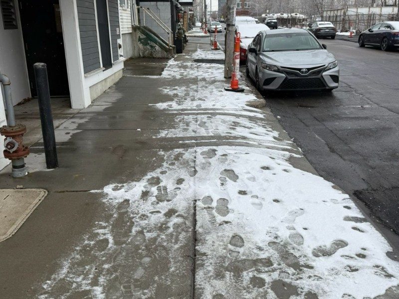 Commercial sidewalk ice management & salting — before
